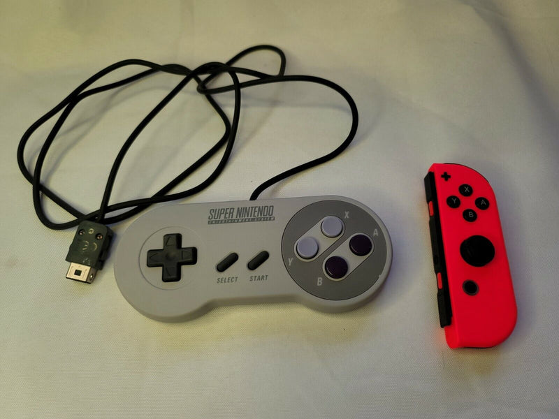 Both Super Nintendo Controller Clv-202 & Orange Joy-Con Right For The Nintendo